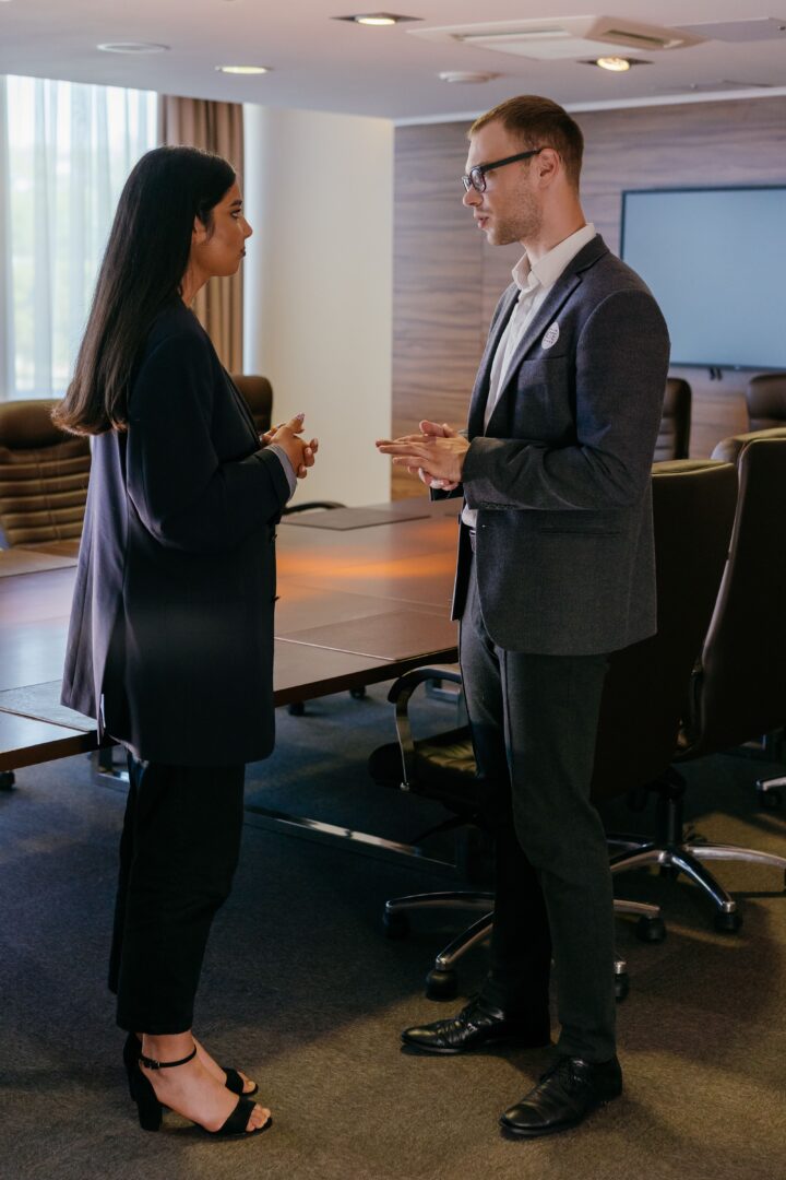 Experience Manager taking to tenant in building conference center