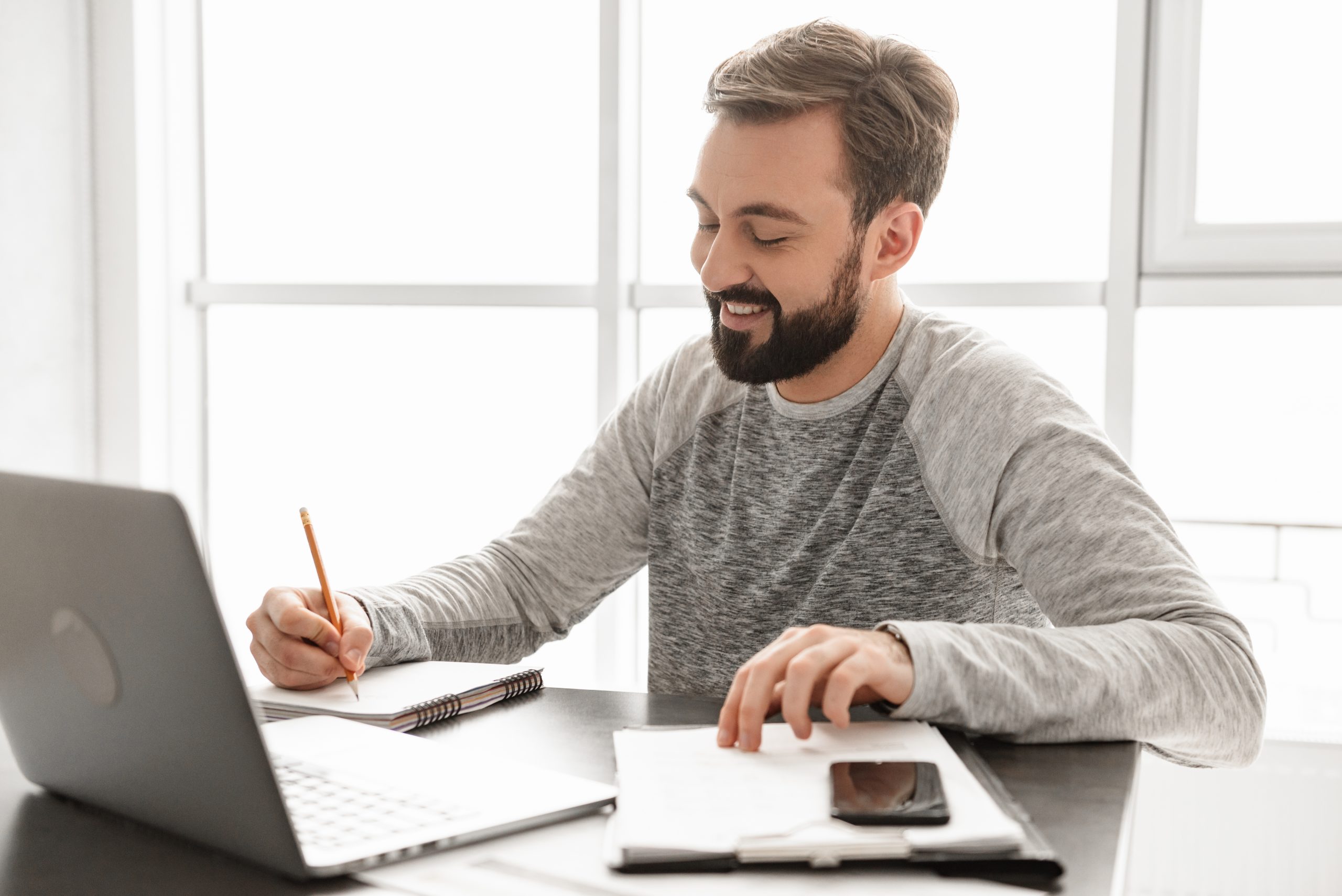 Portrait of a smiling young man working